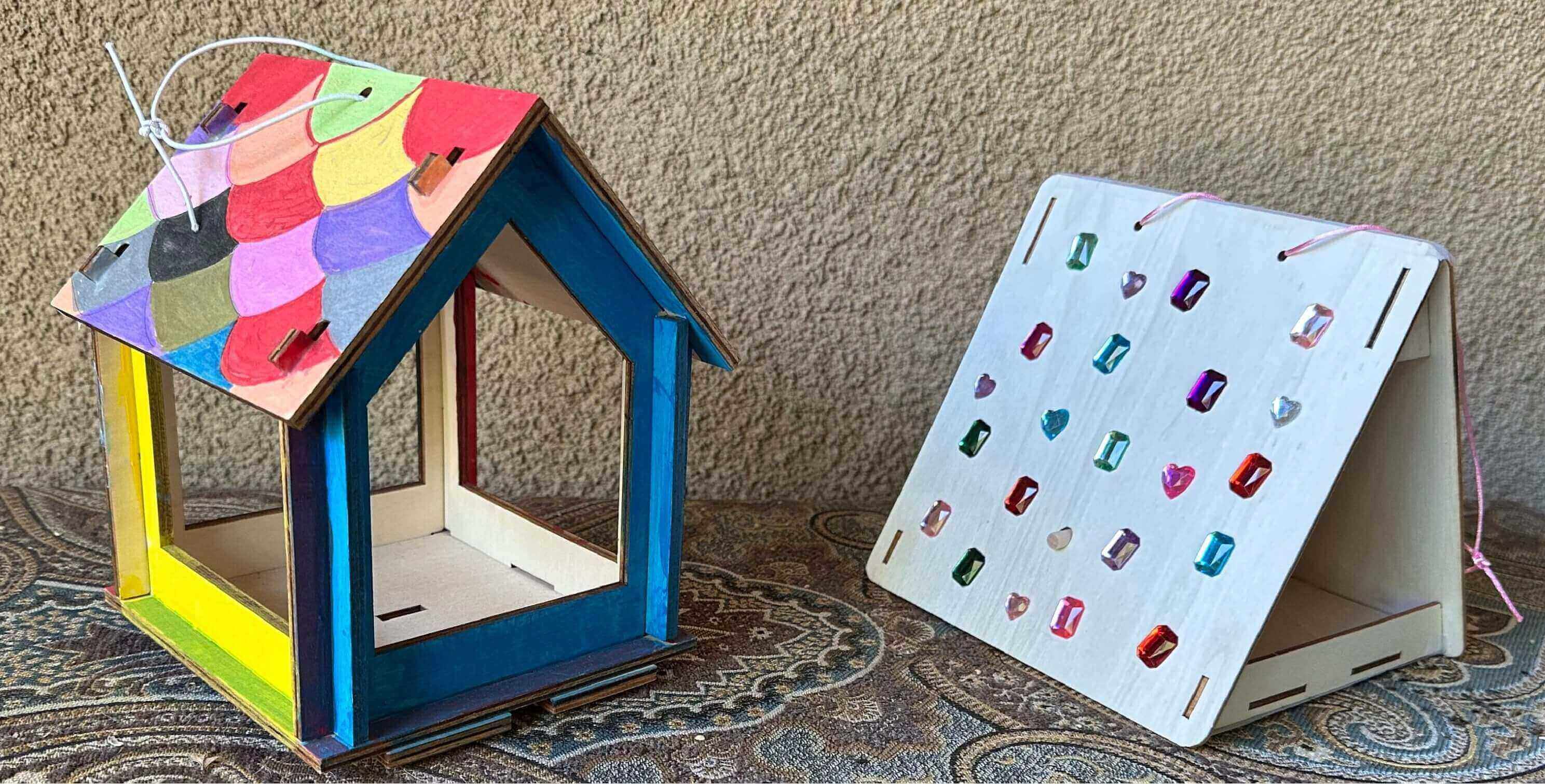 Colorful wooden birdhouse and jeweled display
