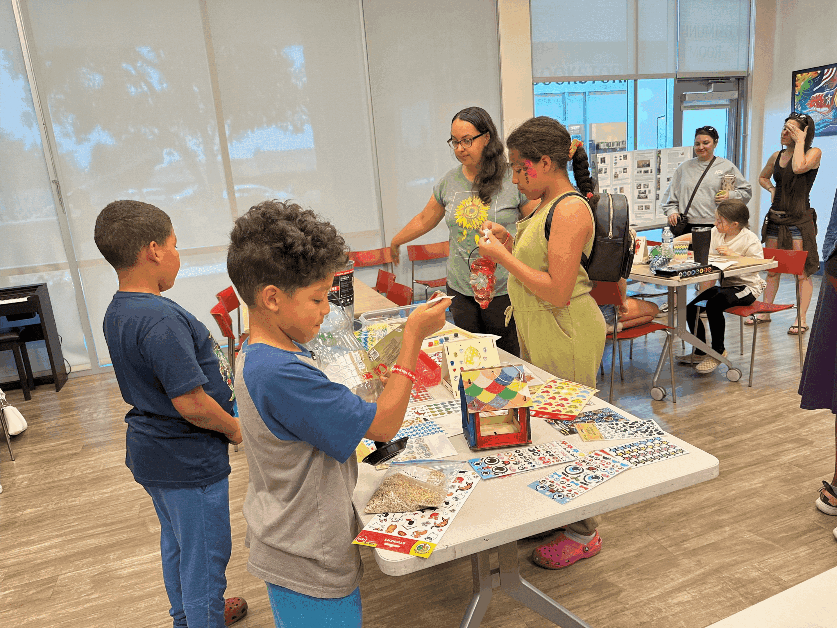 Children crafting at table in activity room